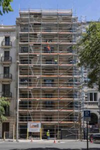 What is scaffolding? — A structure installed on a building facade in Barcelona